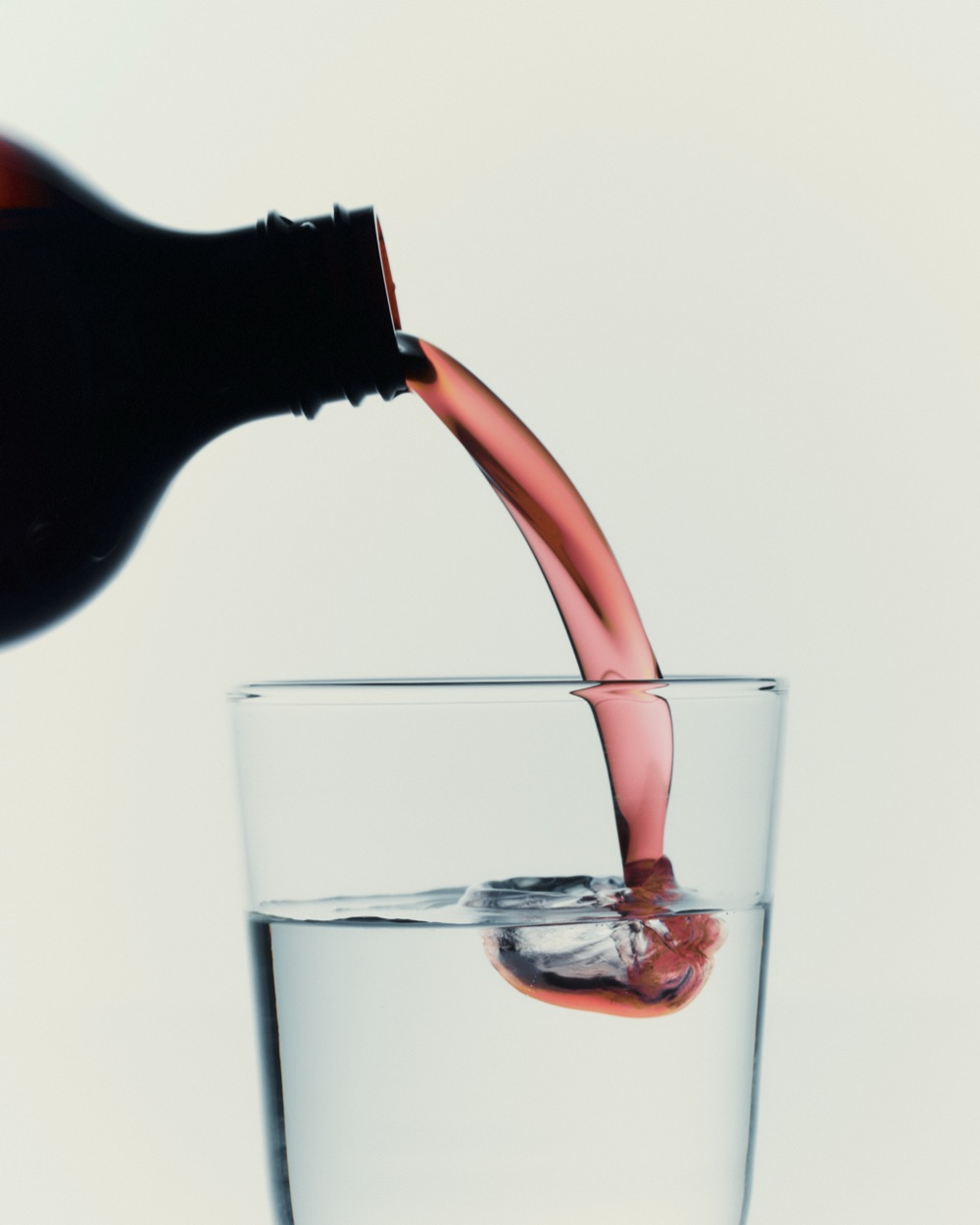 IMBIBE Beauty Renewal liquid probiotic poured into water